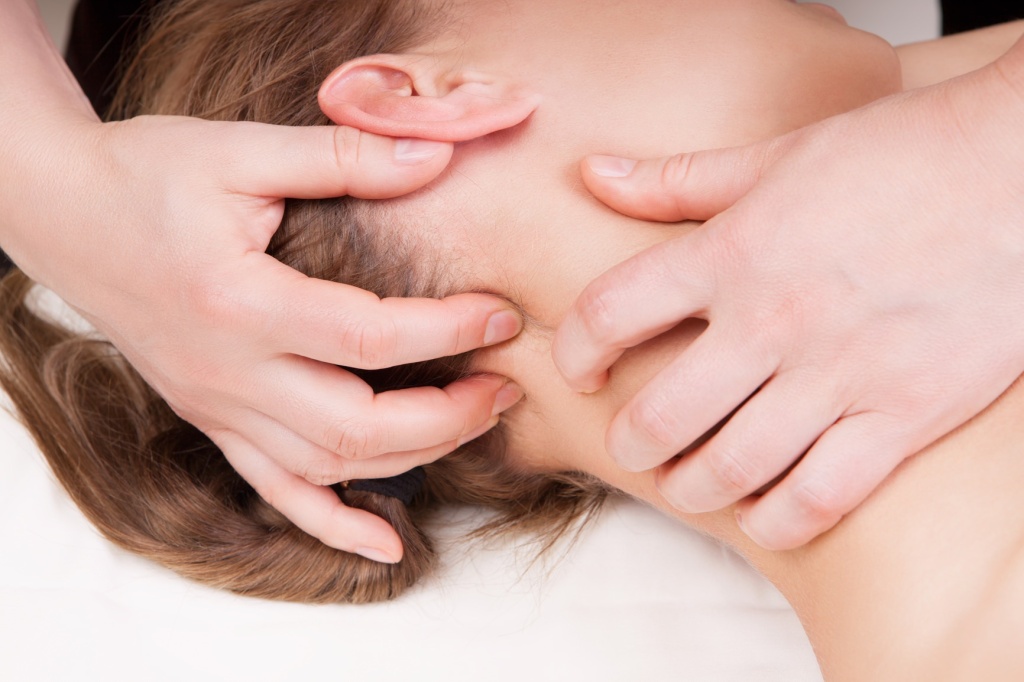 A woman getting a stress relieving pressure point massage on her  Osteopathy photodune 5039178 a woman getting a stress relieving pressure point massage on her m 1024x682